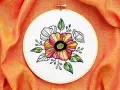 Hermoso bordado de flores coloridas y hojas, ideal como patrones de flores para bordar e imprimir.