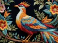 Pájaro vibrante rodeado de flores y hojas, un ejemplo de bordados modernos llenos de color y detalle.