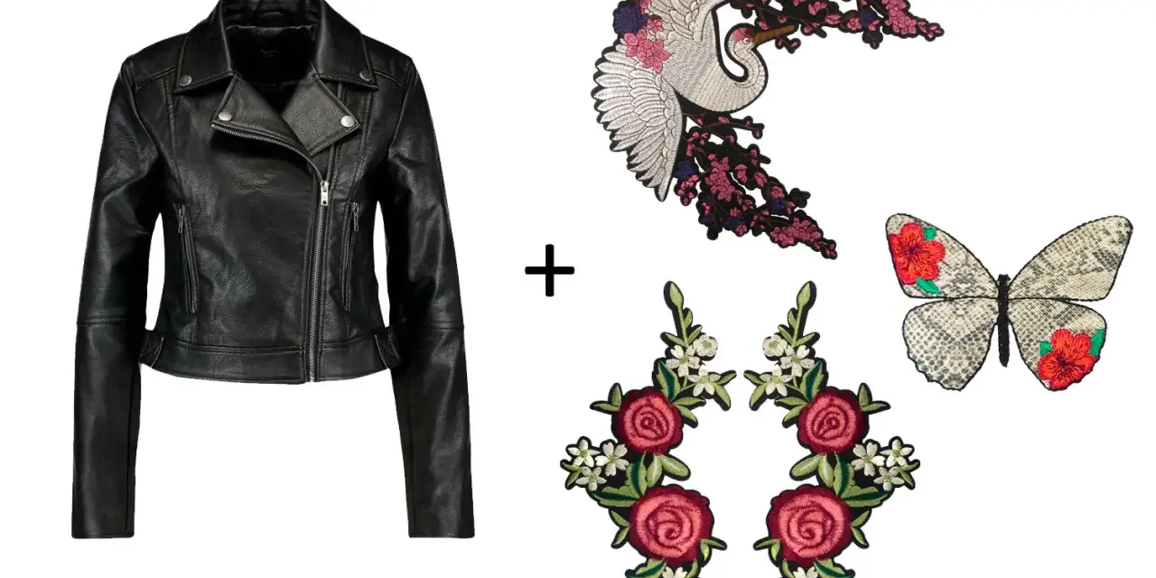 Chaqueta de cuero negra lista para customizar con parches de grulla, mariposa y rosas.