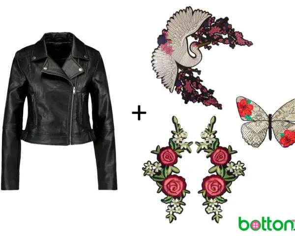 Chaqueta de cuero negra lista para customizar con parches de grulla, mariposa y rosas.