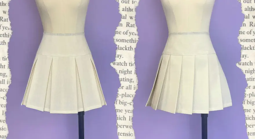 Falda beige con pliegues, una **técnica de costura que forma pliegues en la tela** para un estilo clásico.