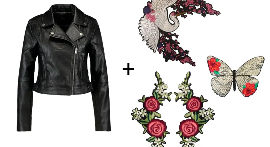 Chaqueta de cuero negra lista para customizar con parches de grulla, mariposa y rosas.